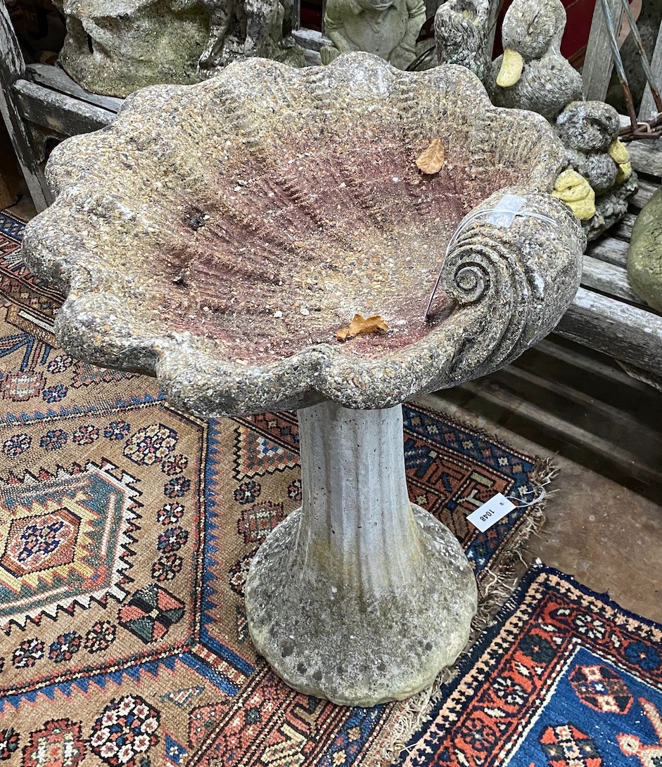 A reconstituted stone bird bath, width 55cm height 69cm